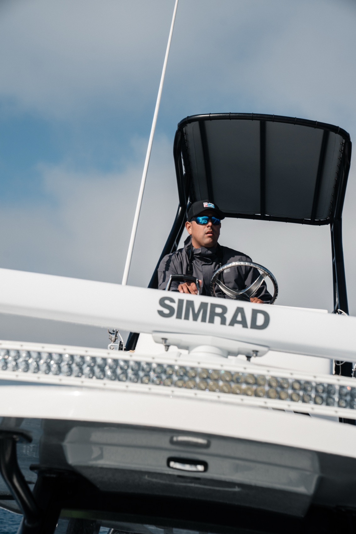 Richard Bargas at the helm tower of an offshore center-console